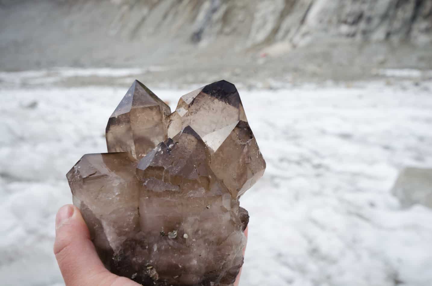 Smoky Quartz being held in a hand