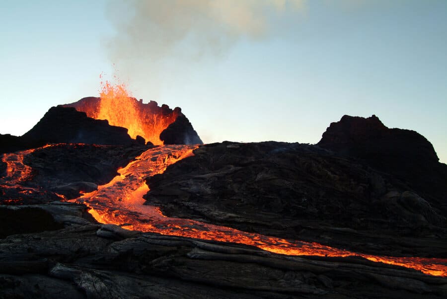 Lava flowing over volcanic rock