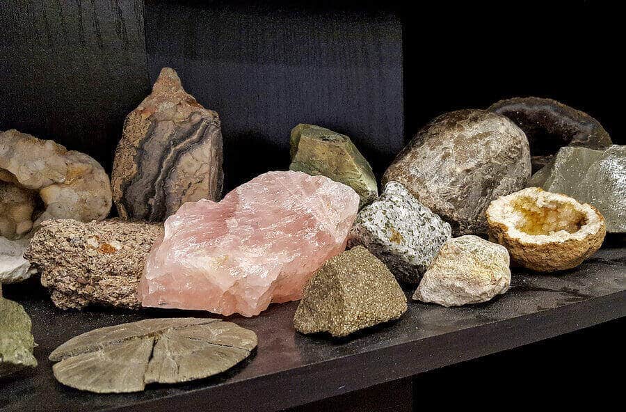 A collection of rocks and minerals on a shelf