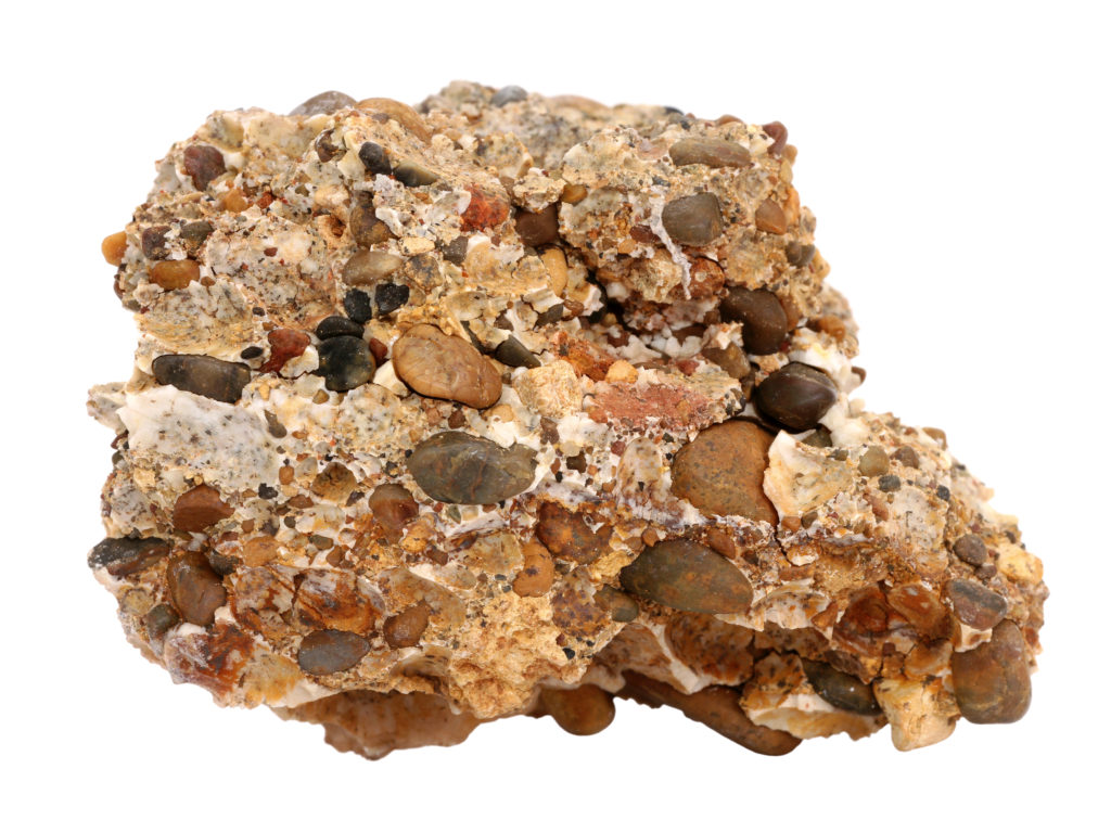 Conglomerate with many differently sized and colored pebbles.