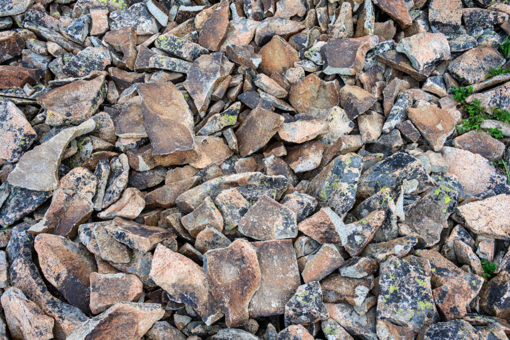 A pile of rough, weathered dacite pieces